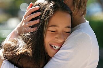 smiling hugging teen girl web