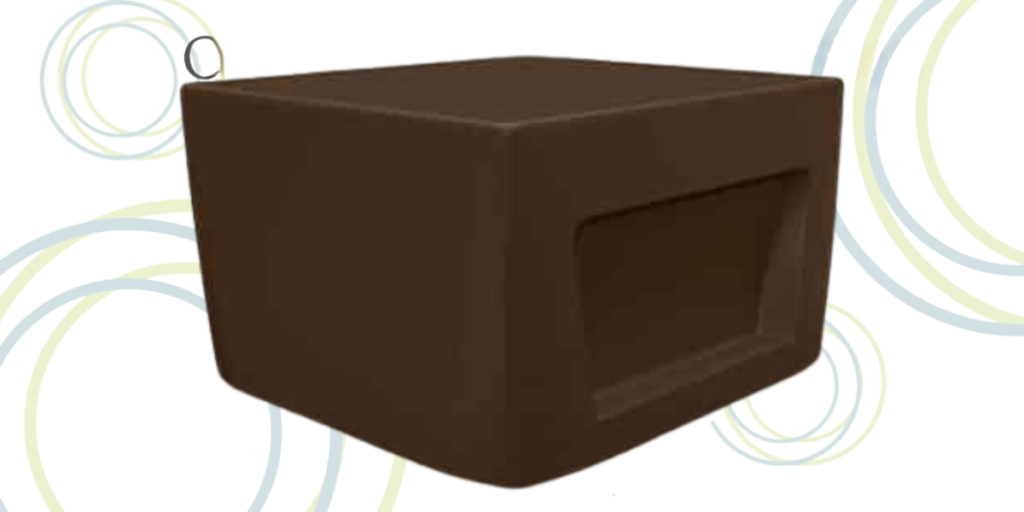 A brown cube with circles around it placed on a ligature-resistant table.