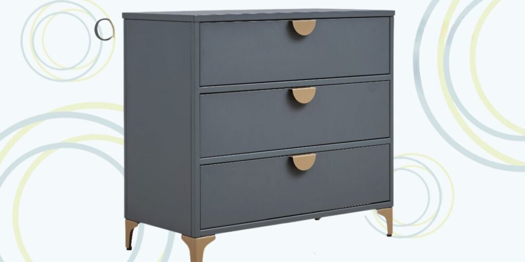 A gray dresser with two drawers and a gold handle. Our Astoria 3 Drawer Chest offers practical storage with an intelligent design.