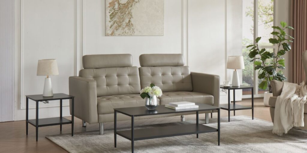 A living room with a couch, coffee table, and two chairs featuring the Chelsea Occasional Table Set for elegance and utility.