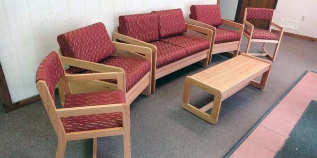 A room with a group of chairs and a table, creating a cozy seating area.