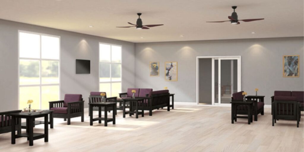 A healthcare facility room with purple chairs and tables, featuring durable and safe seating solutions for patient comfort and convenience.