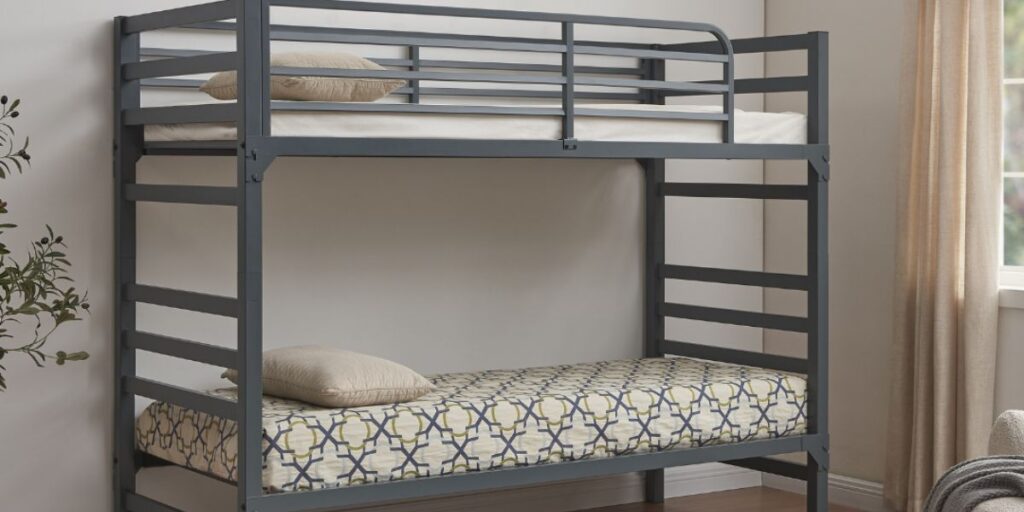A bunk bed featuring a bed and a chair, emphasizing safety with guardrails and proper assembly for health facilities.