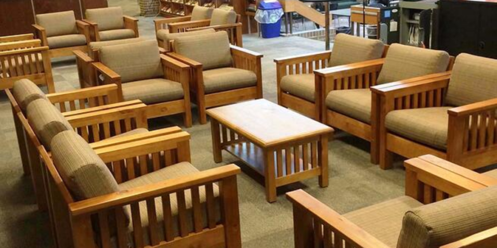 A spacious room filled with durable chairs and tables, designed for comfort and safety in behavioral healthcare settings.