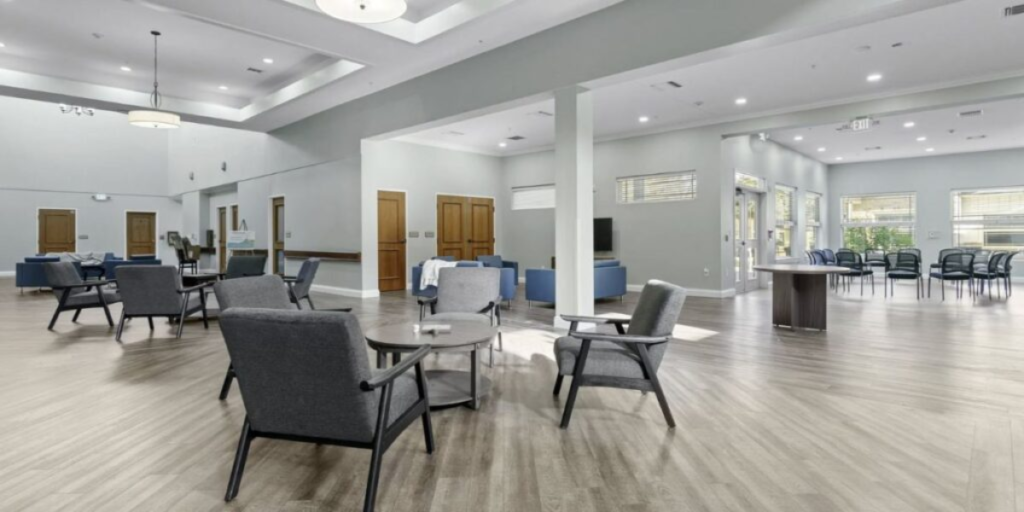 A welcoming dining room in a senior living community, featuring comfortable seating and a warm, inviting atmosphere.