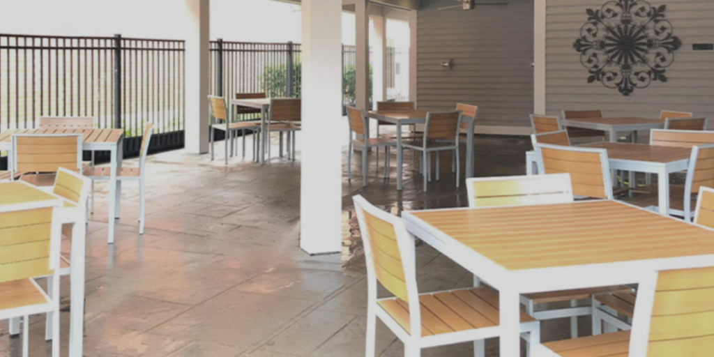 Outdoor dining setup at Lake Charles resort, featuring flexible seating and a cozy ambiance for relaxation and connection.