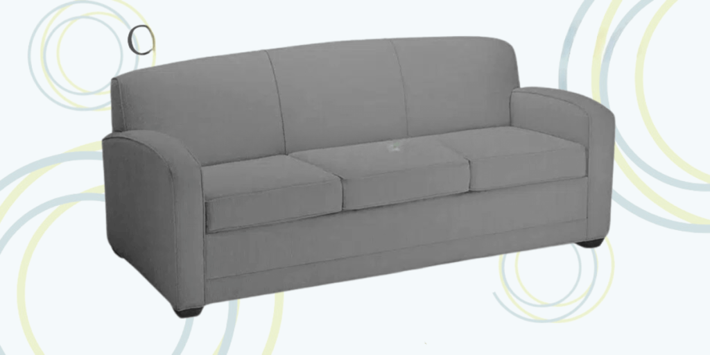 Gray couch featuring a circular pattern, designed for durability in residential treatment centers. Ideal for high-traffic use.