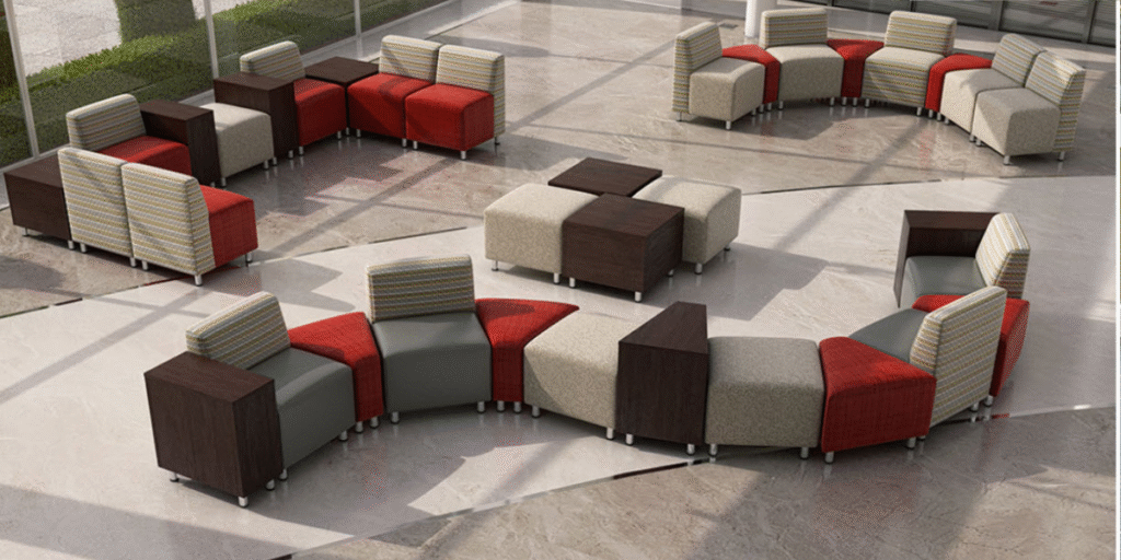 Circular seating area featuring red and gray chairs, designed for durability and aesthetic appeal in therapeutic environments.