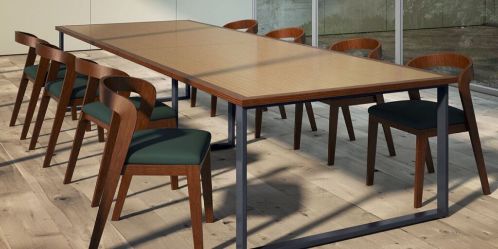 A table with six chairs positioned in front of a large window, suitable for meetings and collaborative discussions.