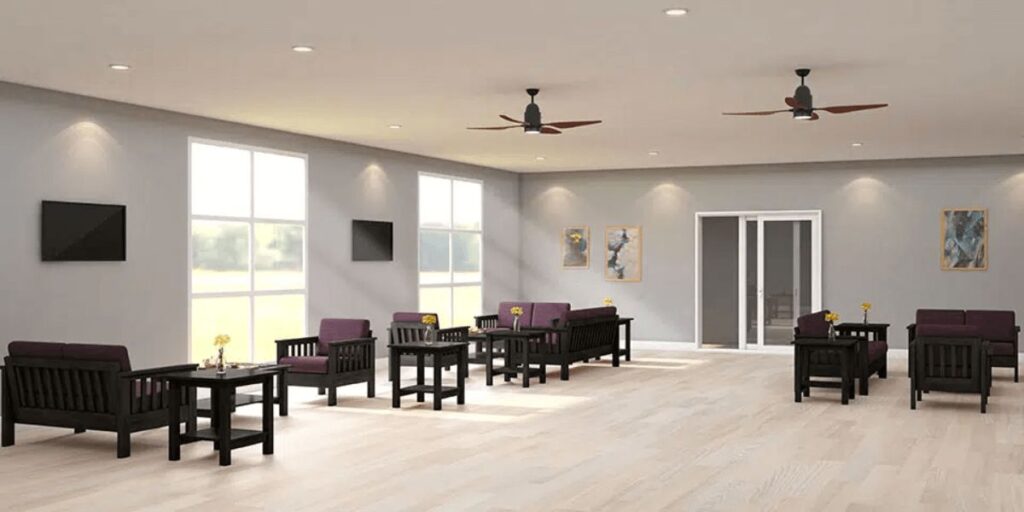 A spacious room featuring a ceiling fan and several chairs, suitable for a healthcare or therapeutic environment.