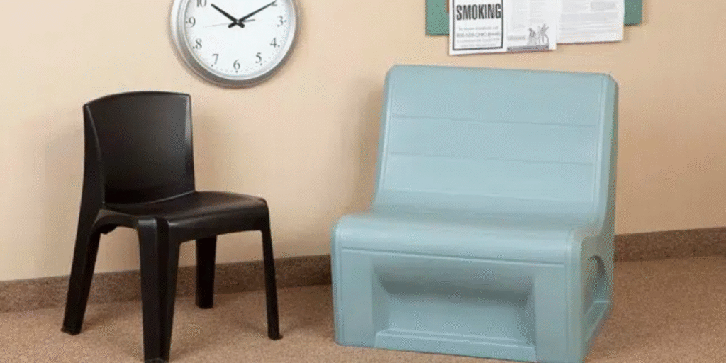 A therapy room featuring a chair and a clock, emphasizing a calm and organized environment for client sessions.