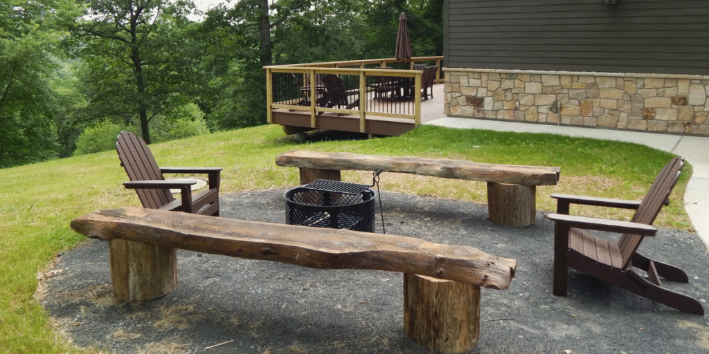 A durable fire pit surrounded by two weather-resistant wooden benches, designed for outdoor care settings.