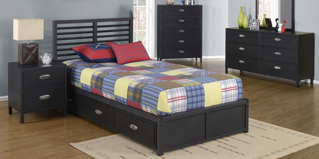 A bed with drawers and a dresser in a room, designed for comfort and functionality in supportive housing environments.