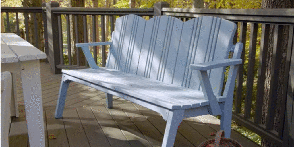 A blue bench on a wooden deck, inviting relaxation and social connection in an outdoor therapeutic space.